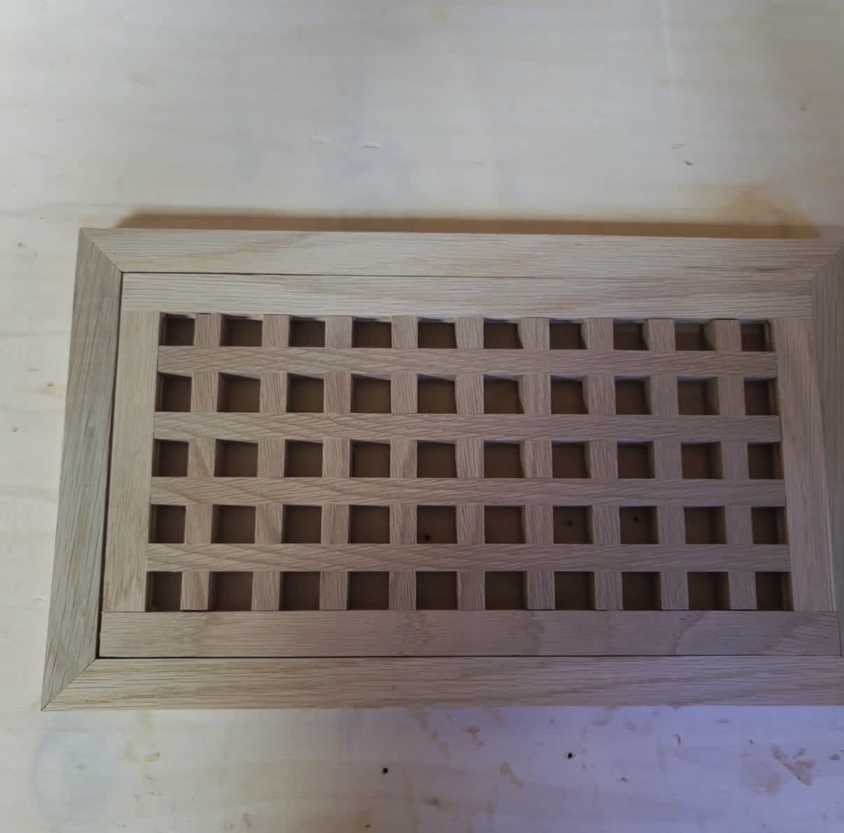 Custom flush wood vent with lattice grille, made in-house