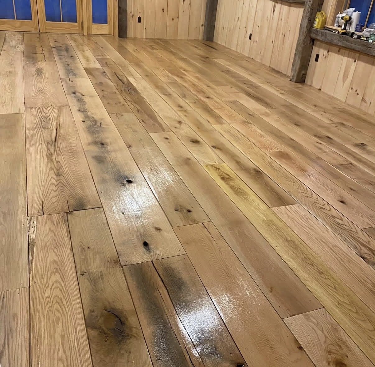 Barn floor with fresh finish coat and natural sheen