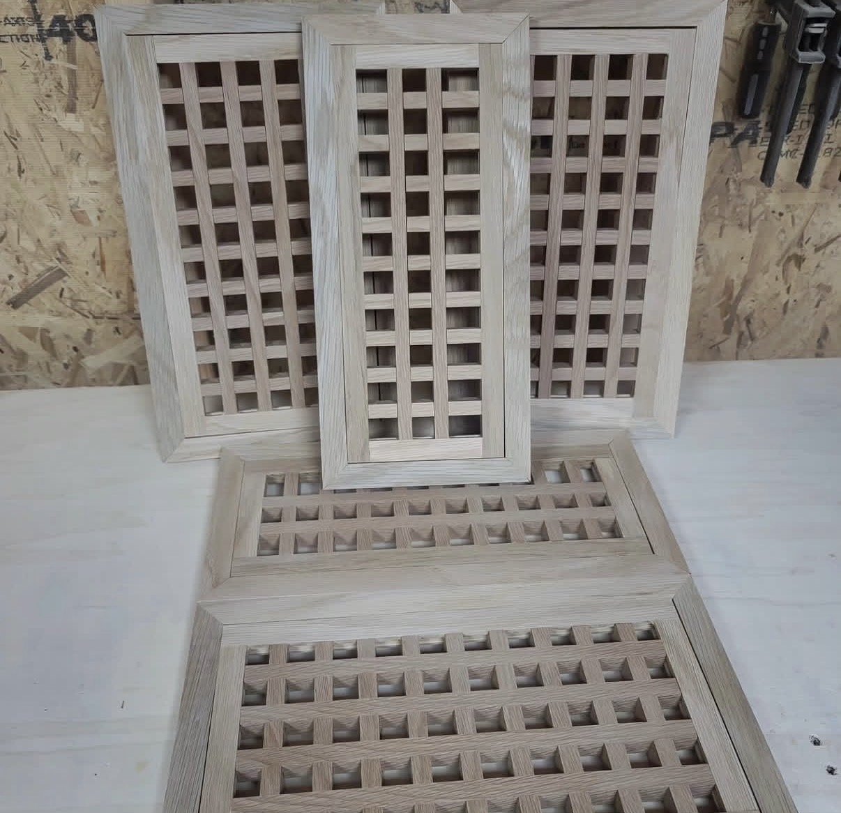 Batch of framed lattice wood vents on the workbench